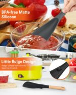 Two Badiano silicone cooking spoons, one black and one grey, with wooden handles, resting on a clean surface.