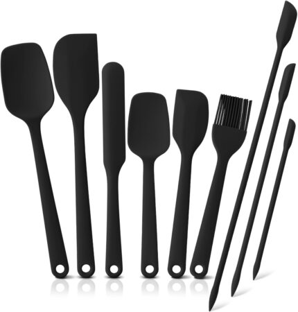 A complete 9-piece set of black silicone spatulas, including various shapes for cooking and baking tasks.