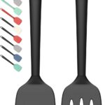 Two PureBlack silicone spatulas, one solid and one slotted, lying on a clean kitchen surface, ready for cooking.