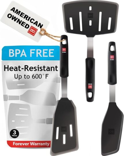 Three di Oro Living silicone spatulas with silver and black handles arranged on a clean kitchen surface, ready for use.