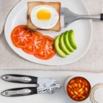 A complete set of 41 Home Hero stainless steel and black silicone kitchen utensils, including measuring cups and spoons.