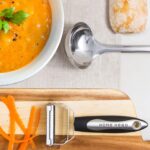 A complete set of 41 Home Hero stainless steel and black silicone kitchen utensils, including measuring cups and spoons.