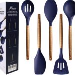 Five midnight blue silicone kitchen utensils with natural acacia wood handles, including a spoon, spoonula, spatula, turner, 