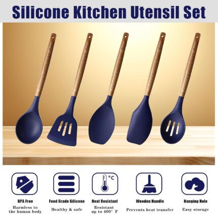 Five midnight blue silicone kitchen utensils with natural acacia wood handles, including a spoon, spoonula, spatula, turner,