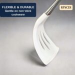 A set of white silicone cooking utensils with stainless steel handles, including a spatula, ladle, spoon, whisk, and tongs.