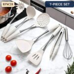 A set of white silicone cooking utensils with stainless steel handles, including a spatula, ladle, spoon, whisk, and tongs.