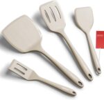 A set of four khaki silicone spatulas of varying sizes, including a slotted and a pancake spatula, on a neutral background.