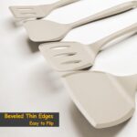 A set of four khaki silicone spatulas of varying sizes, including a slotted and a pancake spatula, on a neutral background.