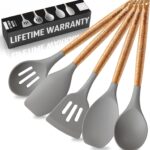 A complete set of five grey silicone cooking utensils with light brown acacia wood handles, arranged neatly.