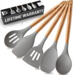A complete set of five grey silicone cooking utensils with light brown acacia wood handles, arranged neatly.