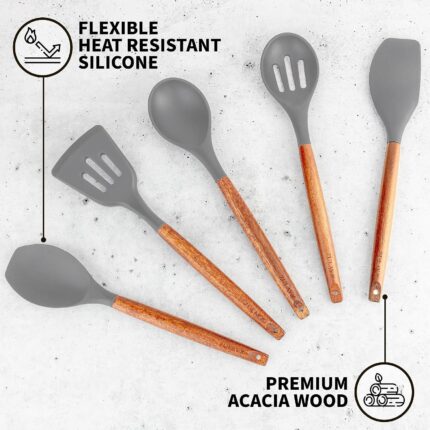A complete set of five grey silicone cooking utensils with light brown acacia wood handles, arranged neatly.